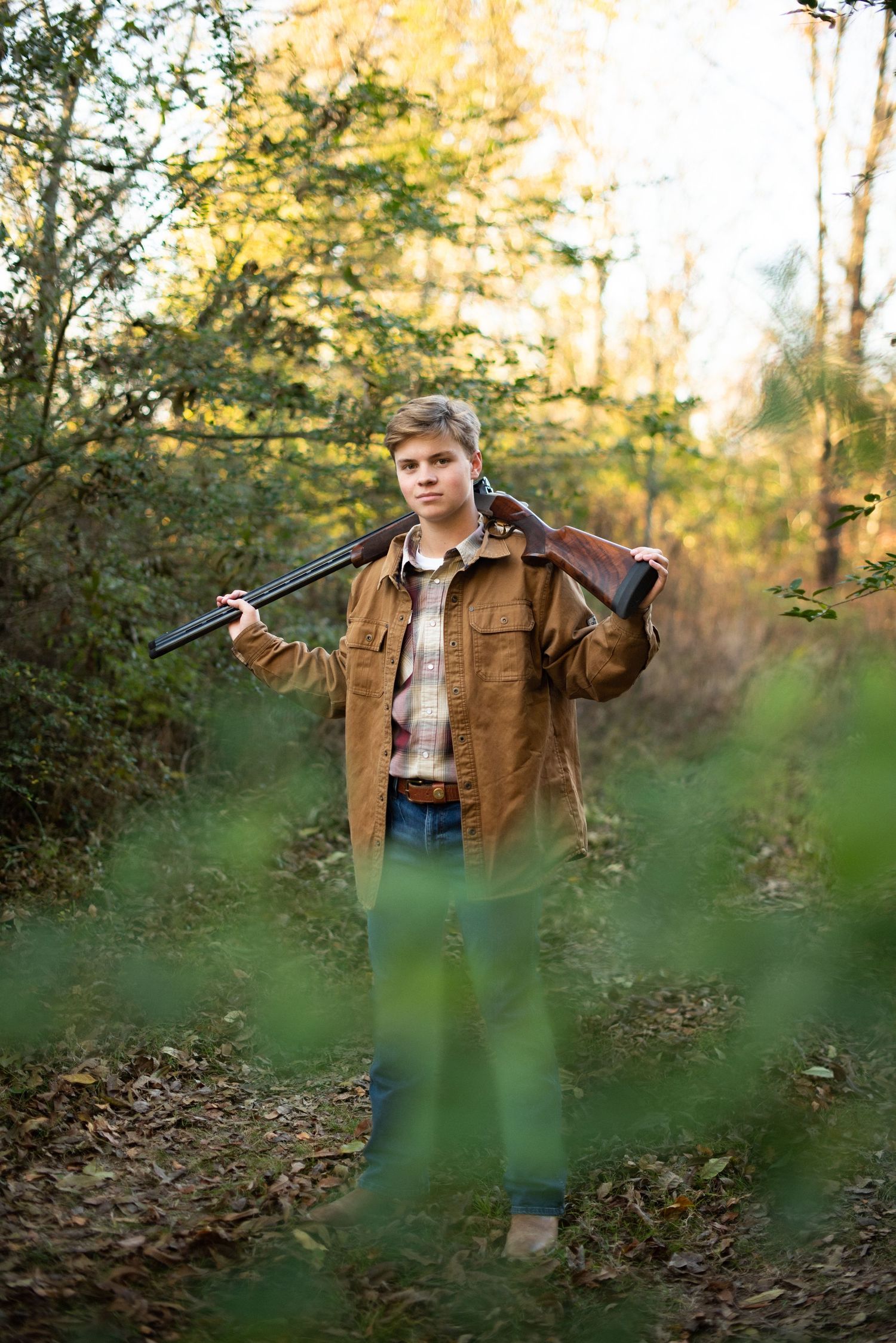 Three outdoor photos of someone wearing a brown jacket and plaid shirt in a wooded autumn setting at golden hour.