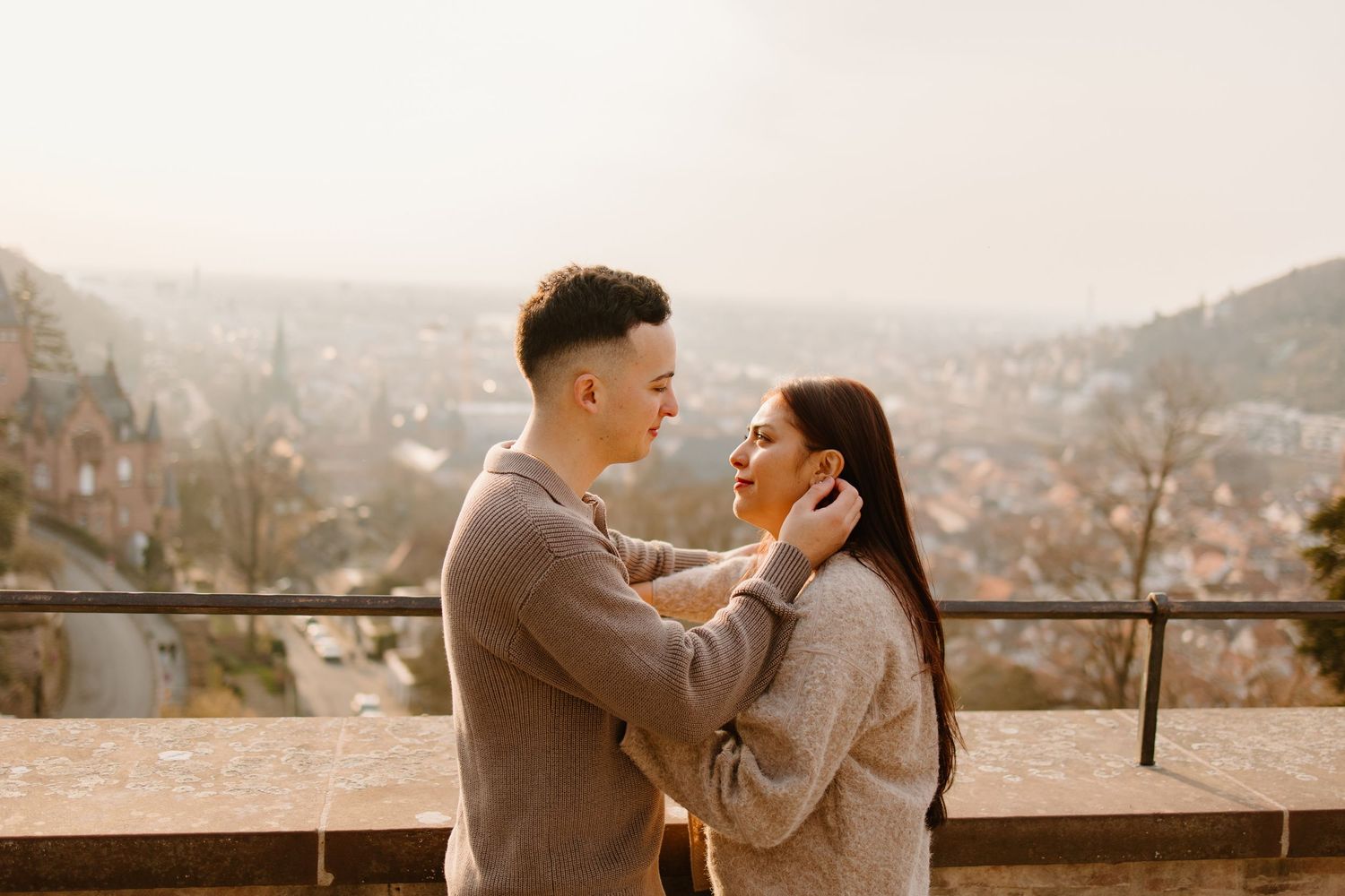 Heidelberg Proposal Photography, Couple celebrating proposal at castle with panoramic view of Heidelberg in the background