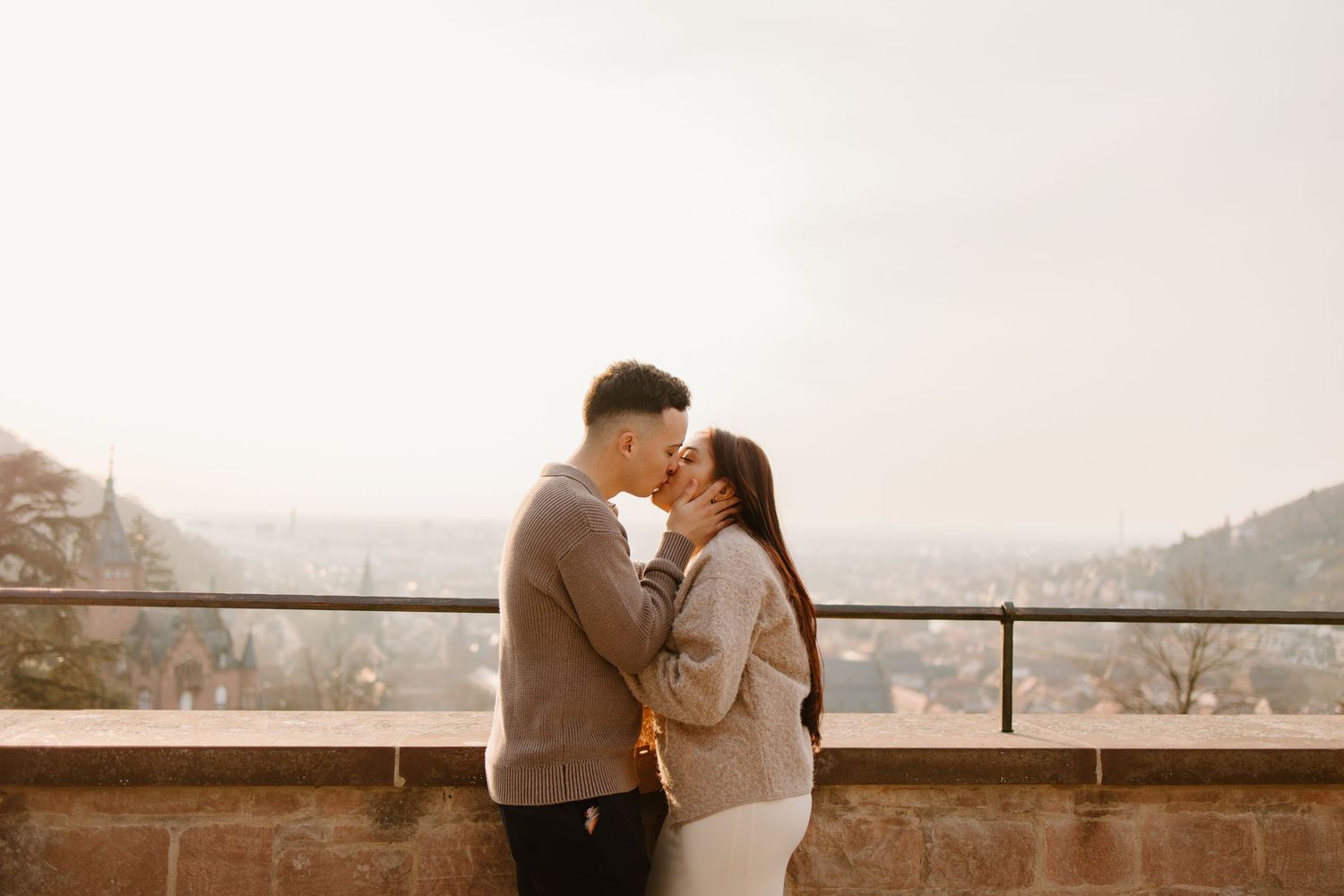 Heidelberg Proposal Photography, Couple celebrating proposal at castle with panoramic view of Heidelberg in the background