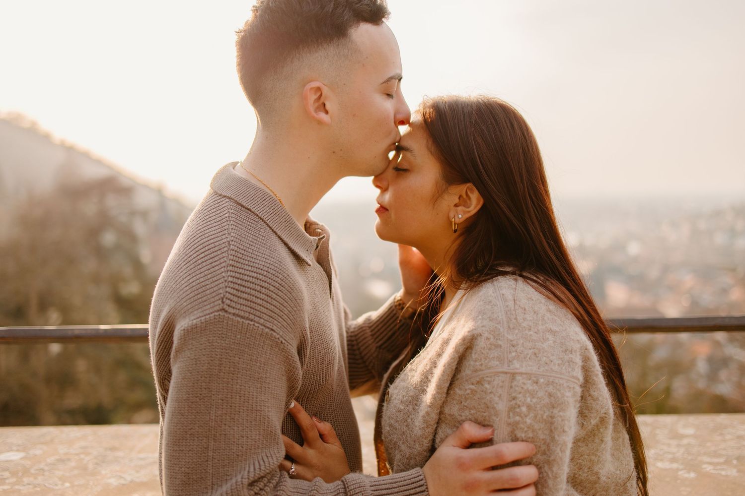 Heidelberg Proposal Photography, Couple celebrating proposal at castle with panoramic view of Heidelberg in the background