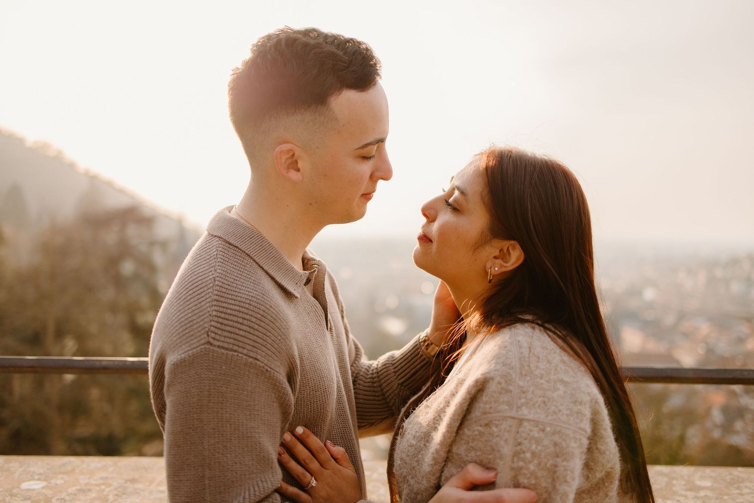 Heidelberg Proposal Photography, Couple celebrating proposal at castle with panoramic view of Heidelberg in the background