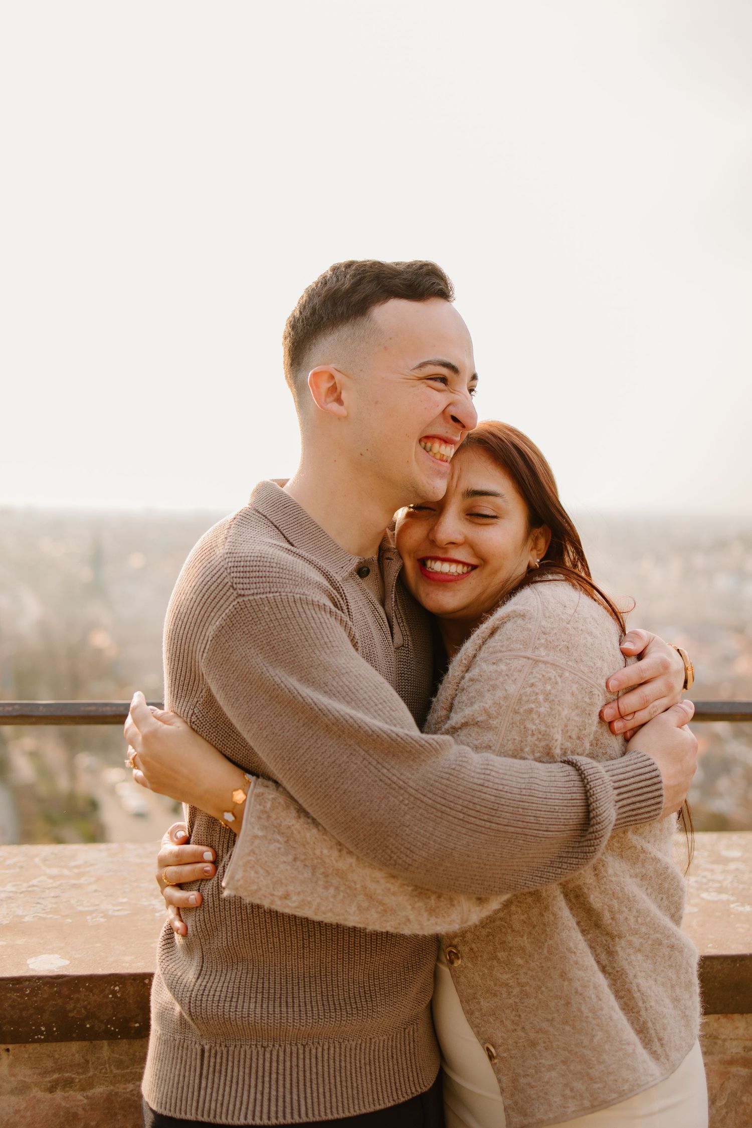 Heidelberg Proposal Photography, Couple celebrating proposal at castle with panoramic view of Heidelberg in the background