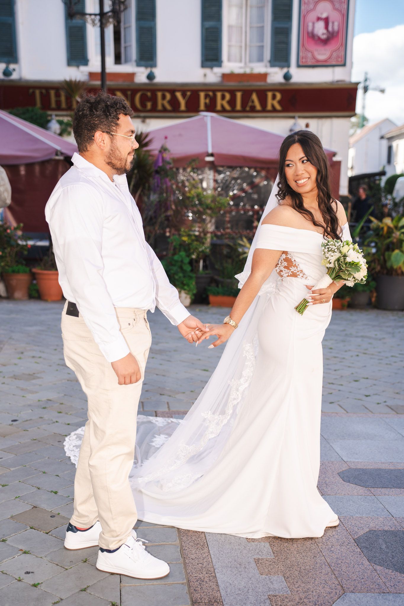 Wedding couple walk through Gibraltar town