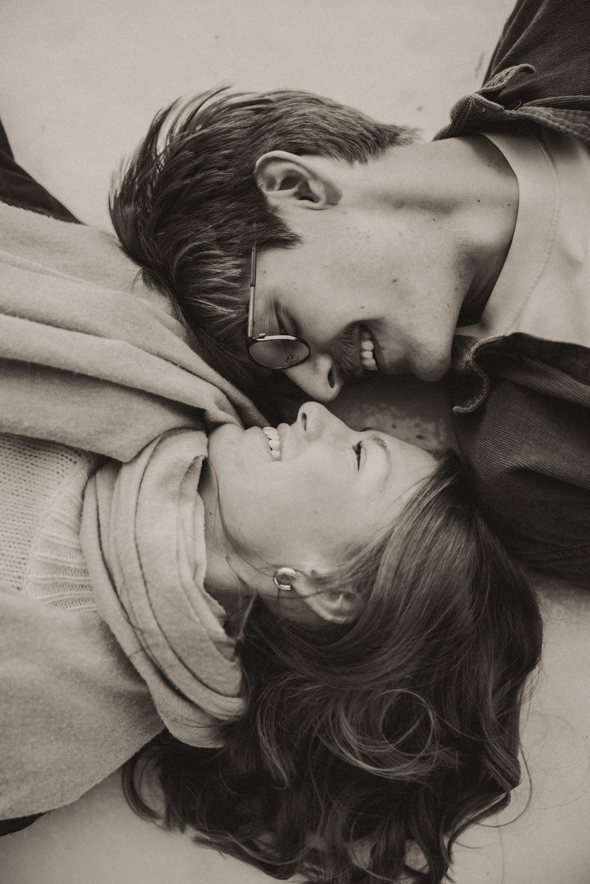 Intimate black and white portrait of couple sharing a tender moment together.