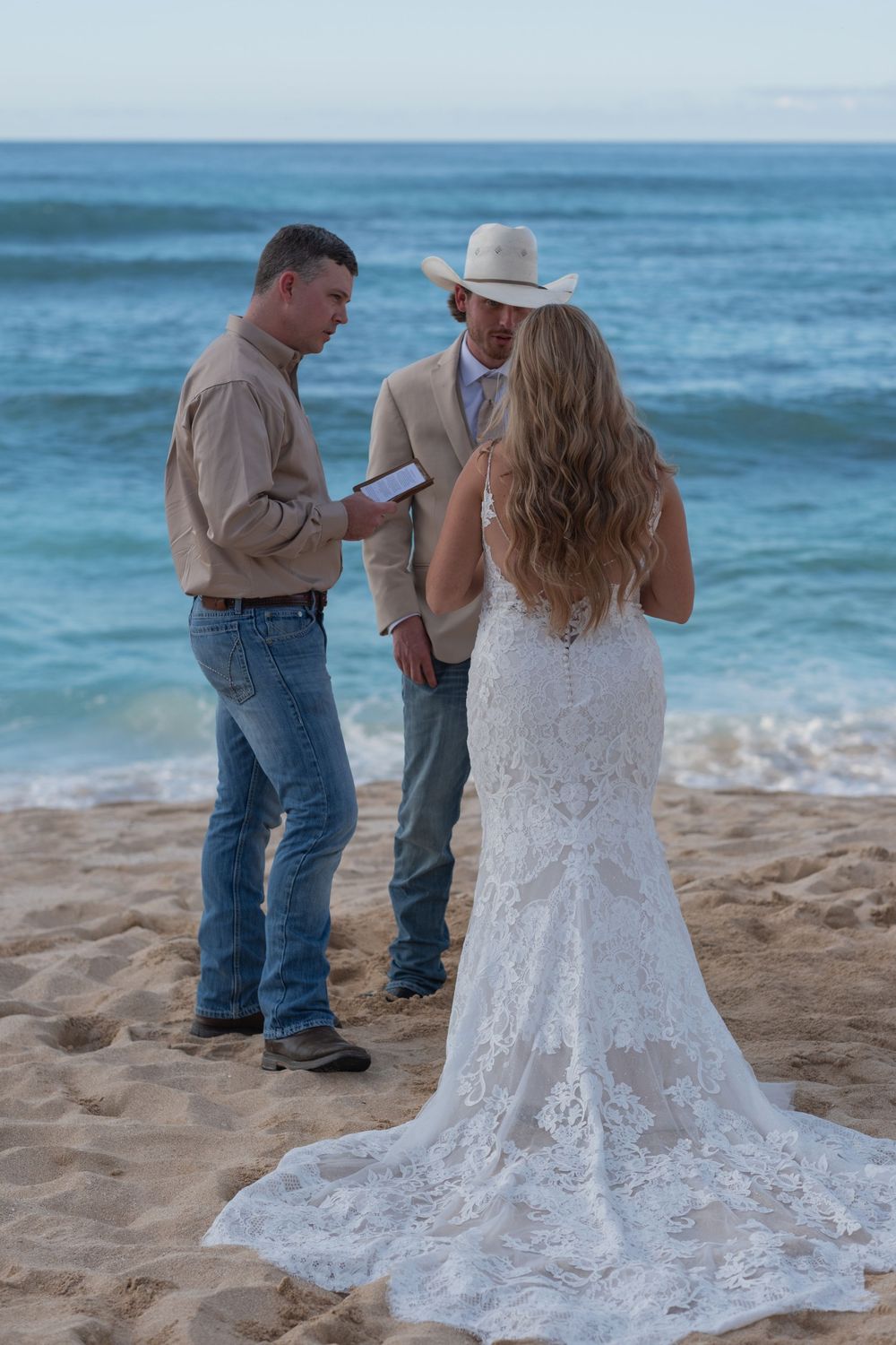 A beach wedding ceremony during a romantic wedding photoshoot on Oahu North Shore