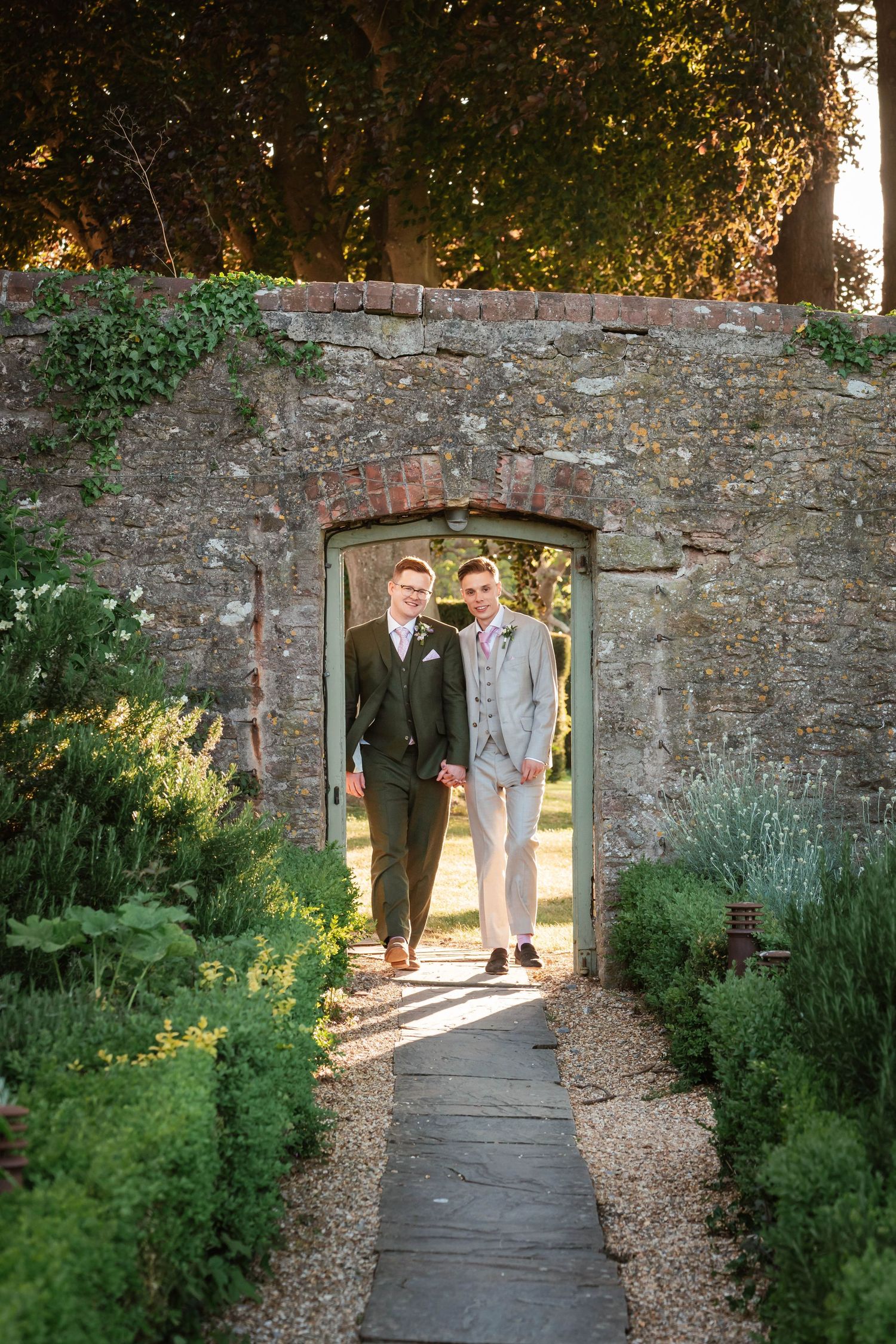 Zara Davis Wedding Photography Bristol Combe Lodge Cotswolds Cheltenham Two grooms in the garden during their wedding