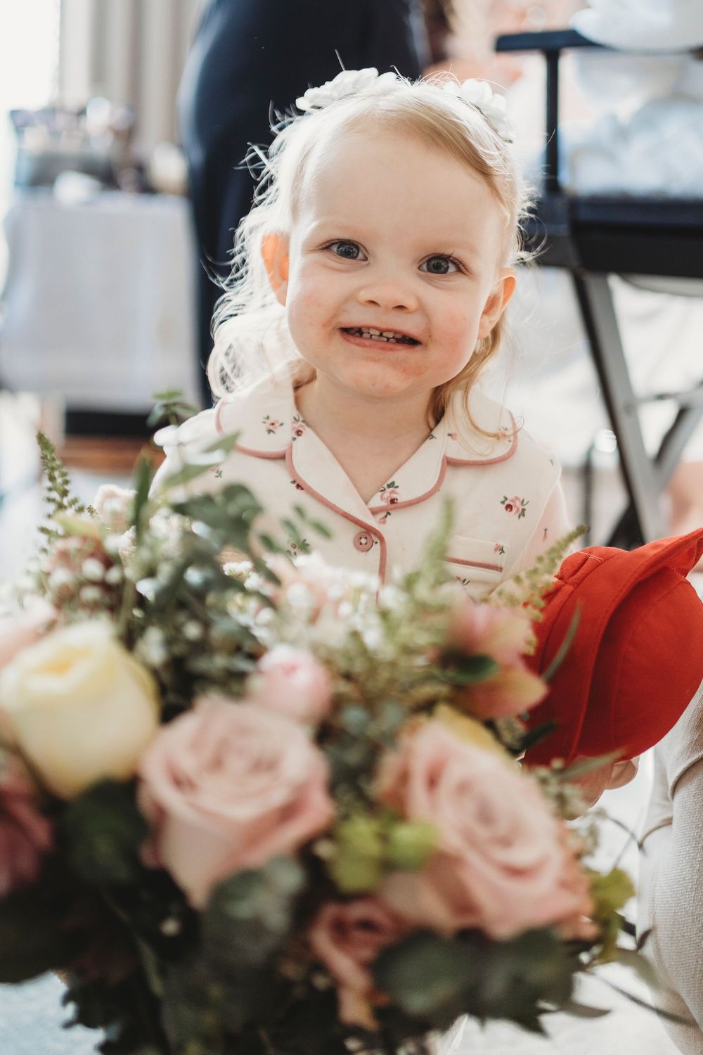 Flower girl portrait with wedding flowers at Parc Le Breos in Gower, West Wales
