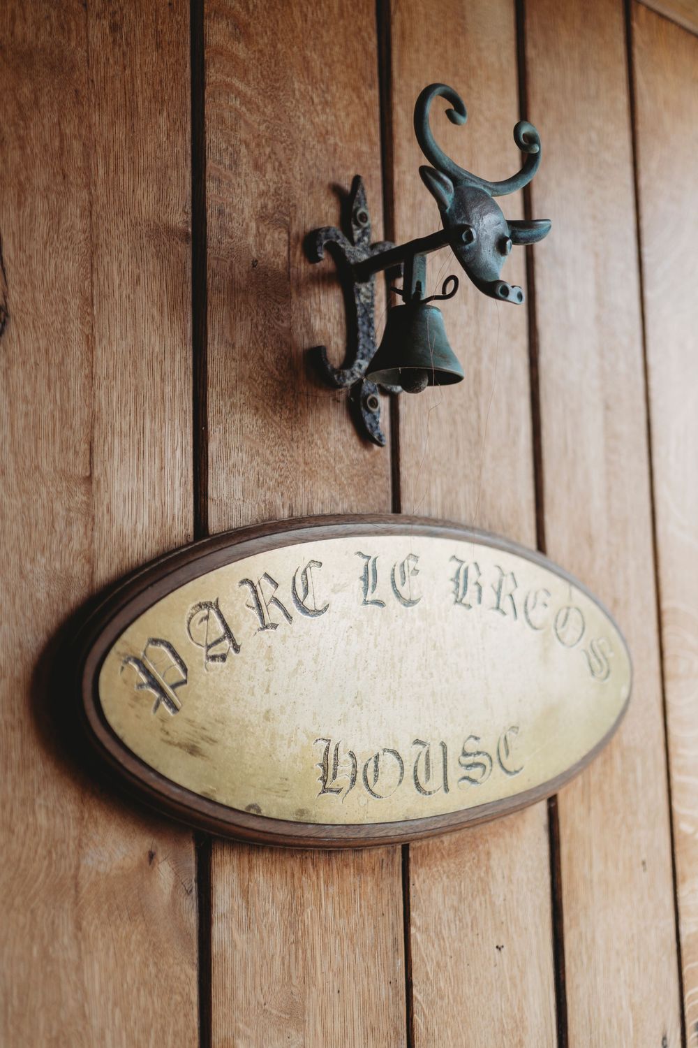 Parc Le Breos sign on wooden door at wedding venue in Gower, West Wales
