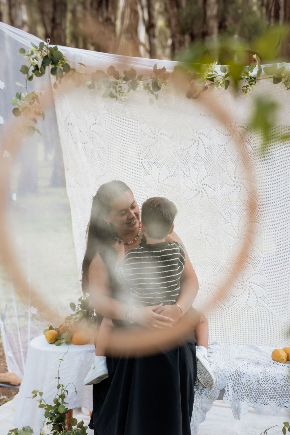 A series of blurred candid shots showing movement against a white lace backdrop with greenery.