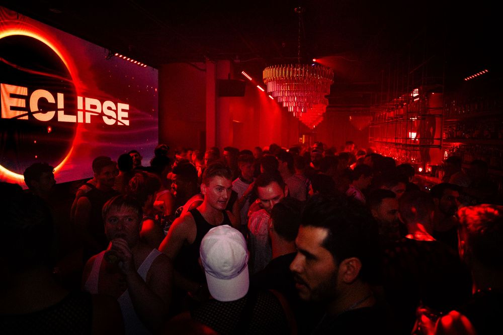 A group of partygoers dance at Eclipse, an event hosted by Dusty Carpenter