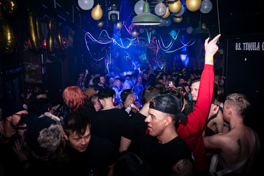 Attendees of a joint CircuitMom and Dusty Carpenter produced event dance at DS Tequila in Northalsted Chicago