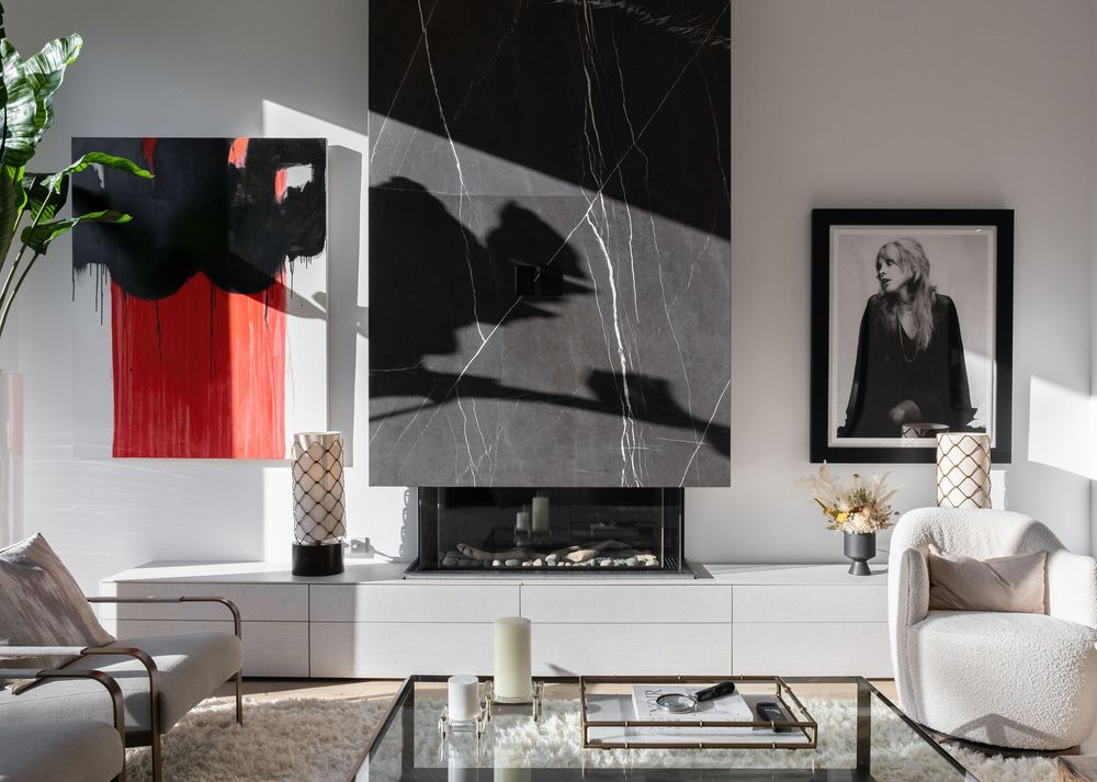 Modern minimalist living room with black and white color scheme featuring sleek furniture and contemporary decor.
