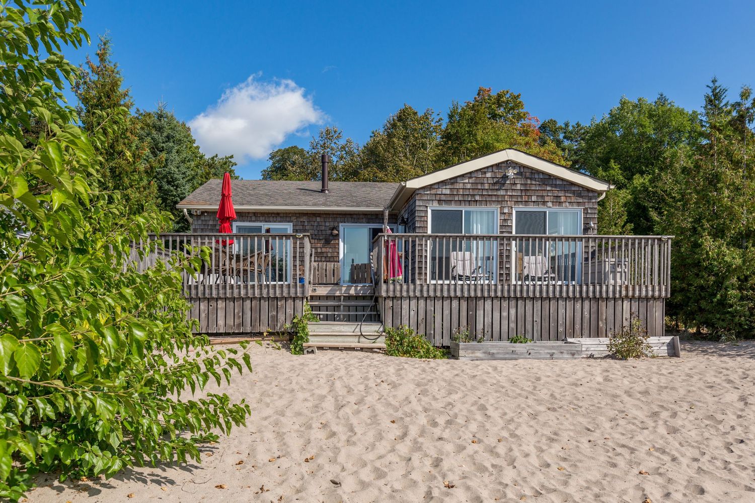 A photo of a beachside cottage in Tiny Beaches Ontario for a real estate listing in Georgian Bay photographed by Sarah Tennant