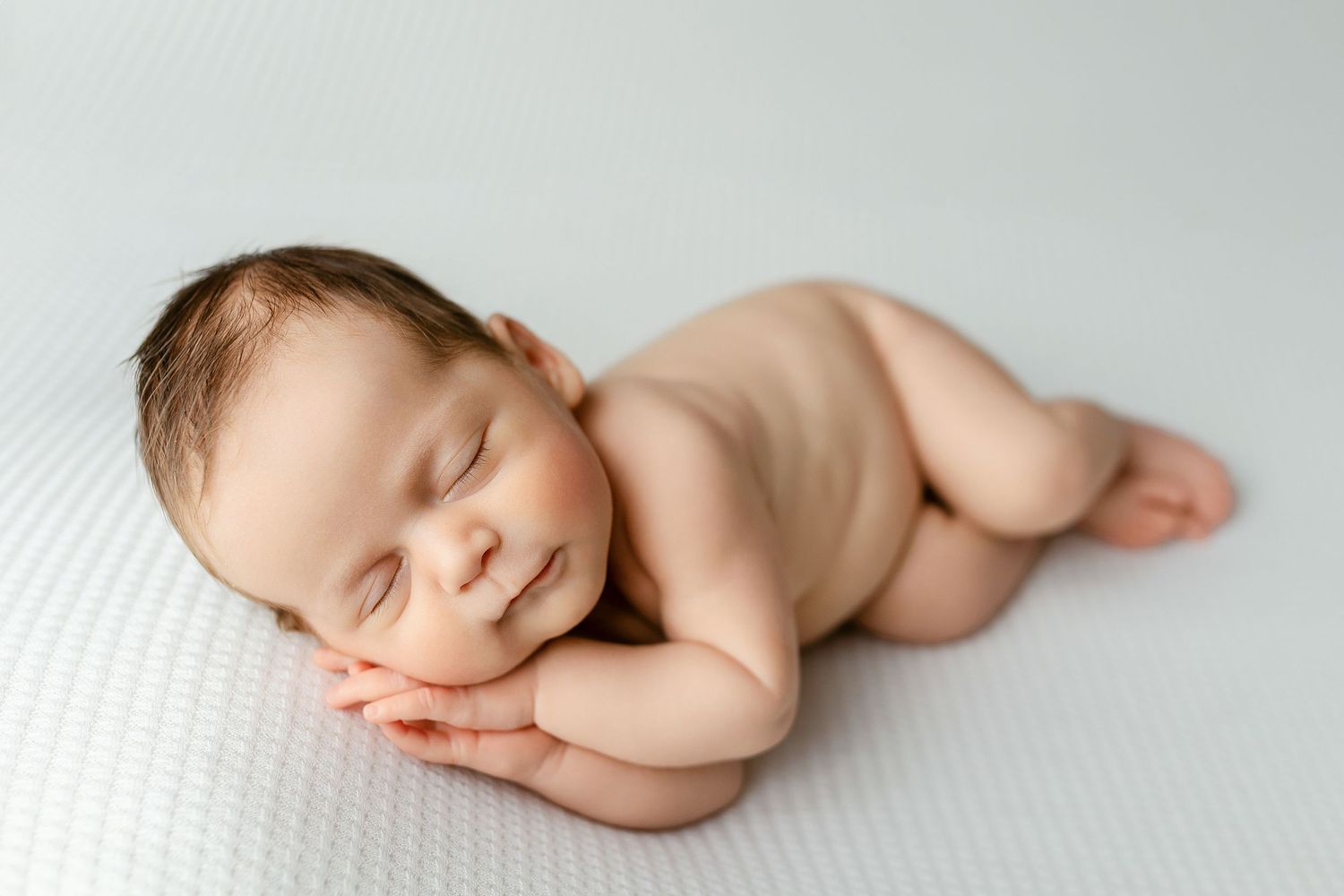 A newborn boy doing the side-lying pose. - Greenville, SC newborn photographer - Easley, SC newborn photographer.