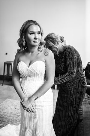 A series of black and white wedding photos showing a person in a white dress posing against a dark background.