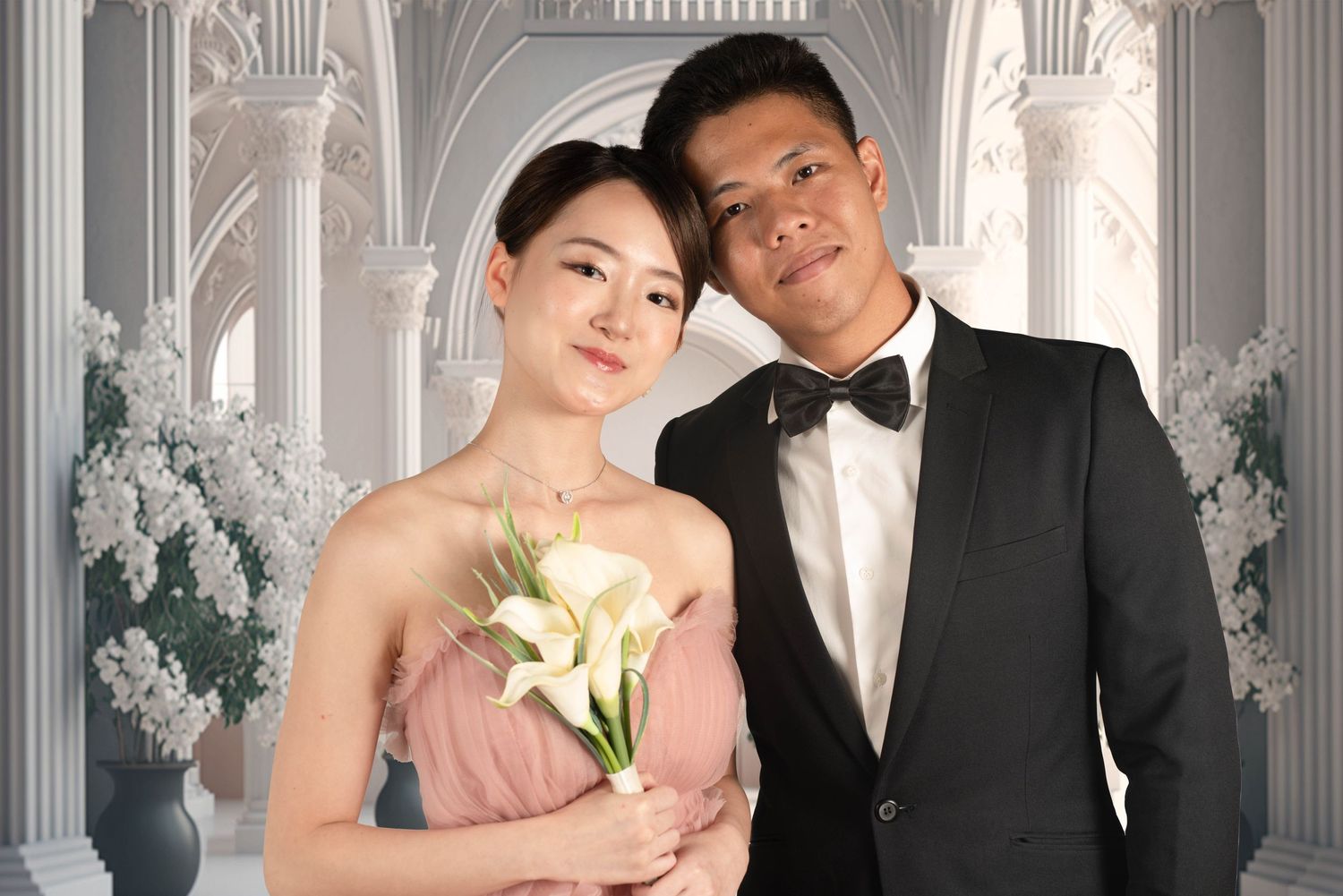 Elegant formal wedding portrait in front of ornate white classical columns.