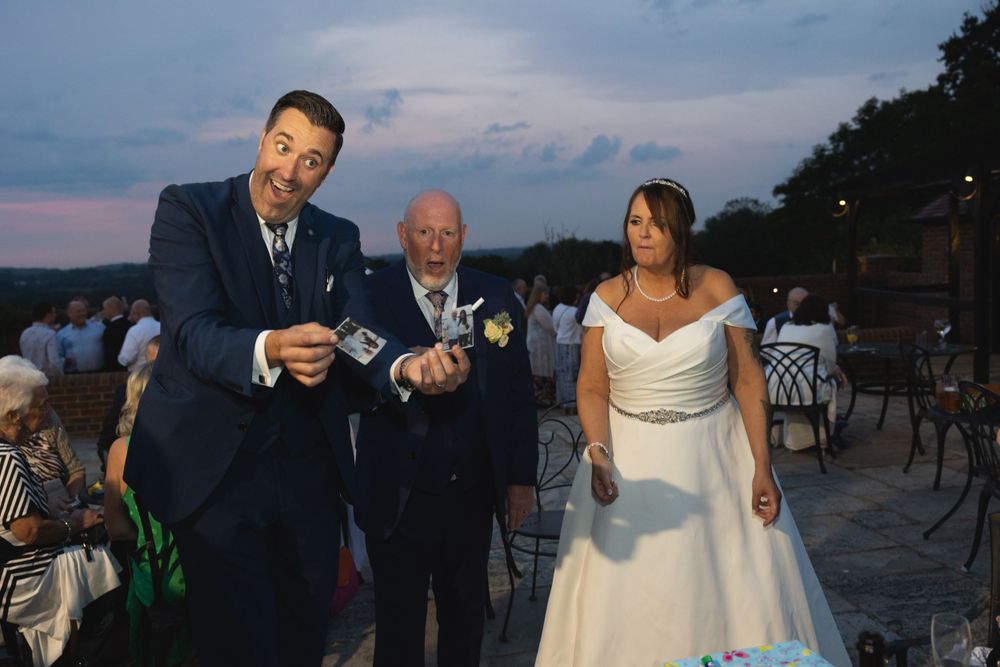 Magician Alexander James performing tricks for wedding guests at Blackstock country estate
