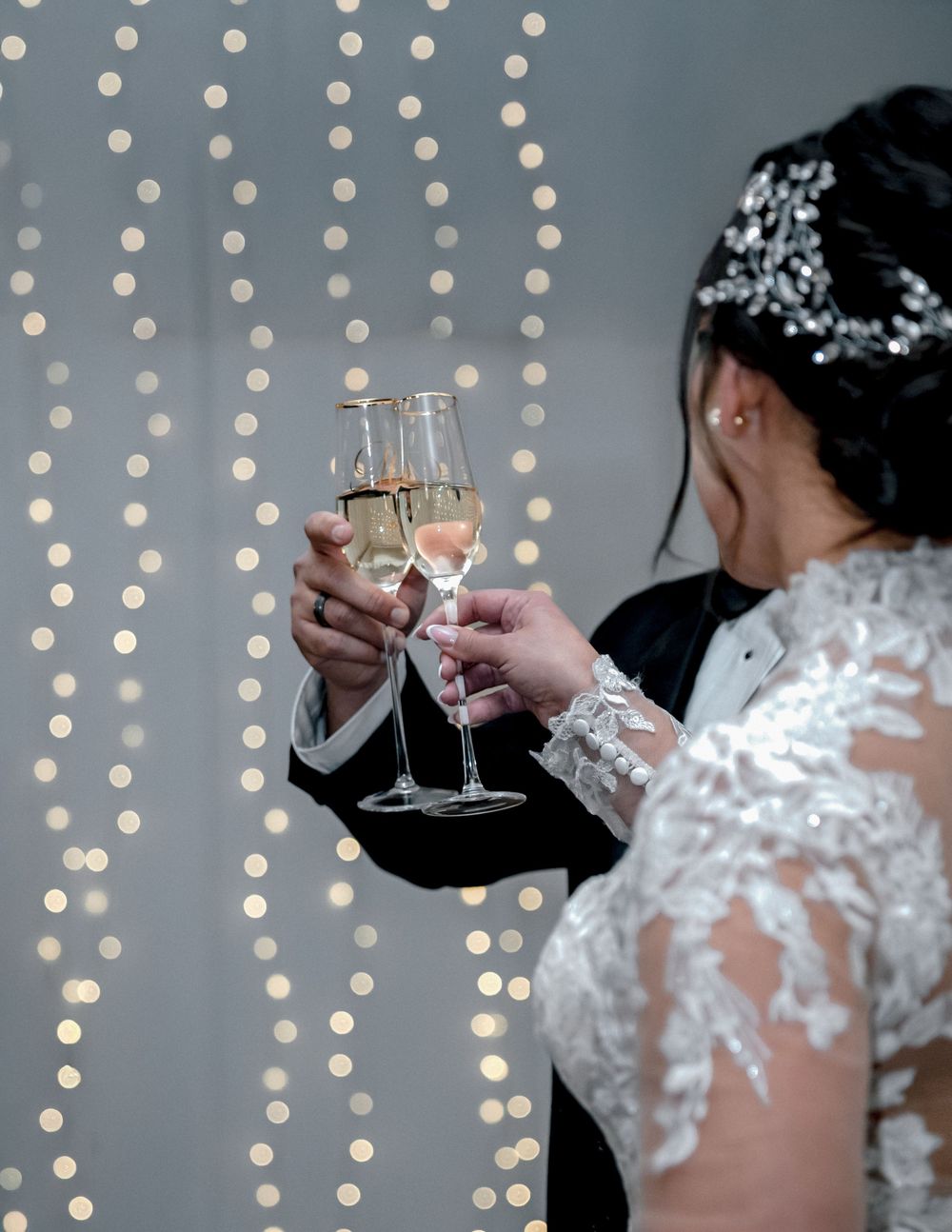 Bride raising glass during wedding toast, elegant celebration moment