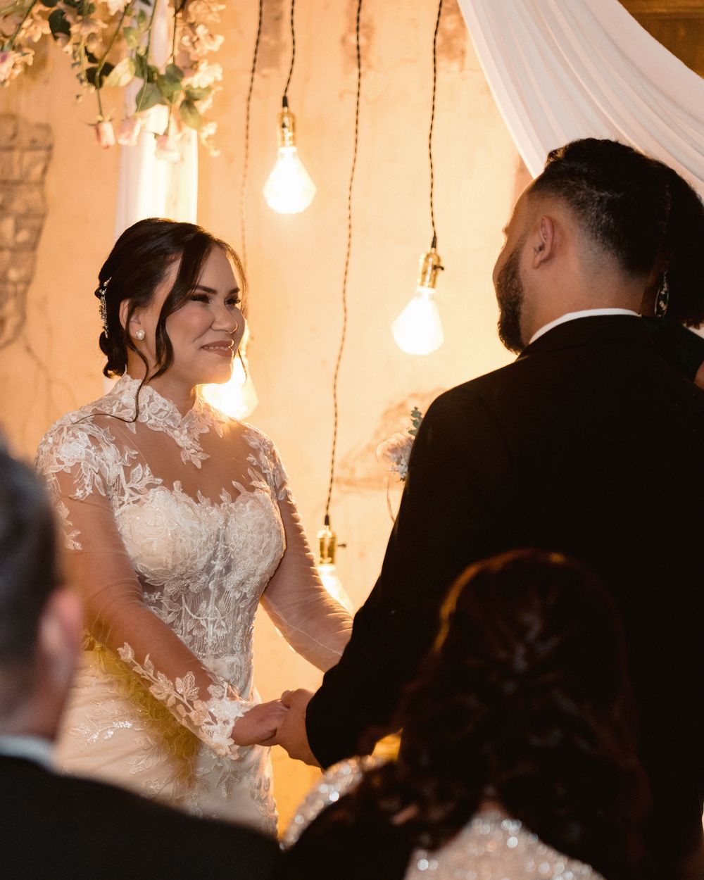 Bride and groom walking together during wedding reception, candid romantic moment