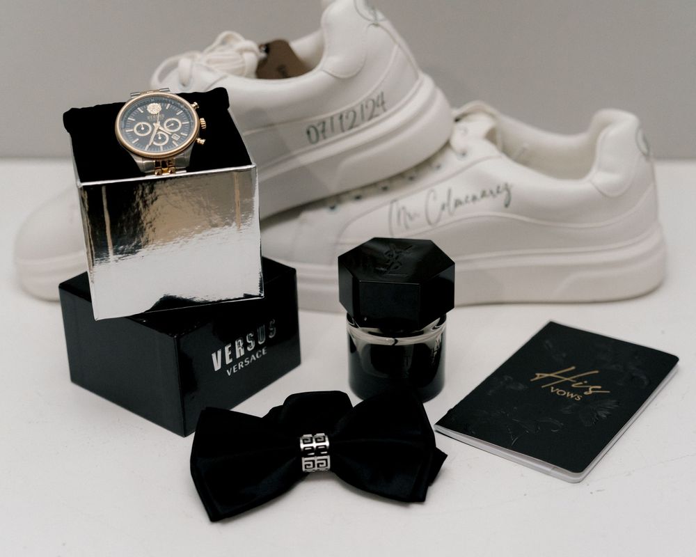 Luxury groom accessories including watch, cufflinks and wedding details flat-lay