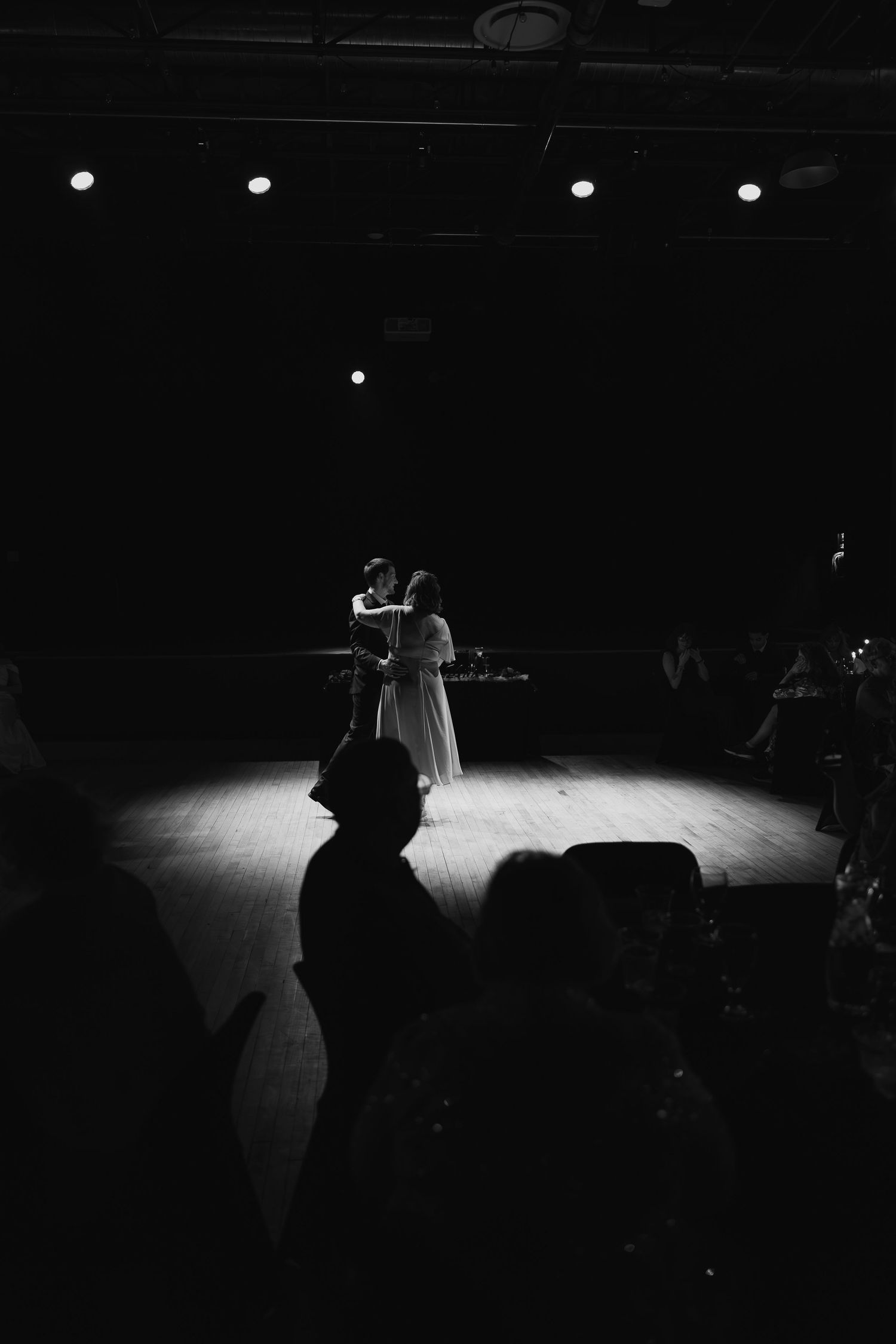 Black and White image of married couple dancing