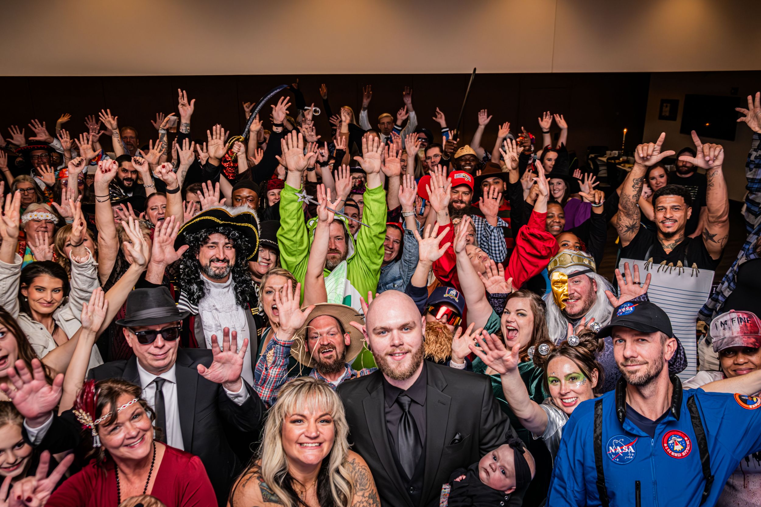 Halloween Themed wedding with group of everyone at the wedding in one shot on the dancefloor.