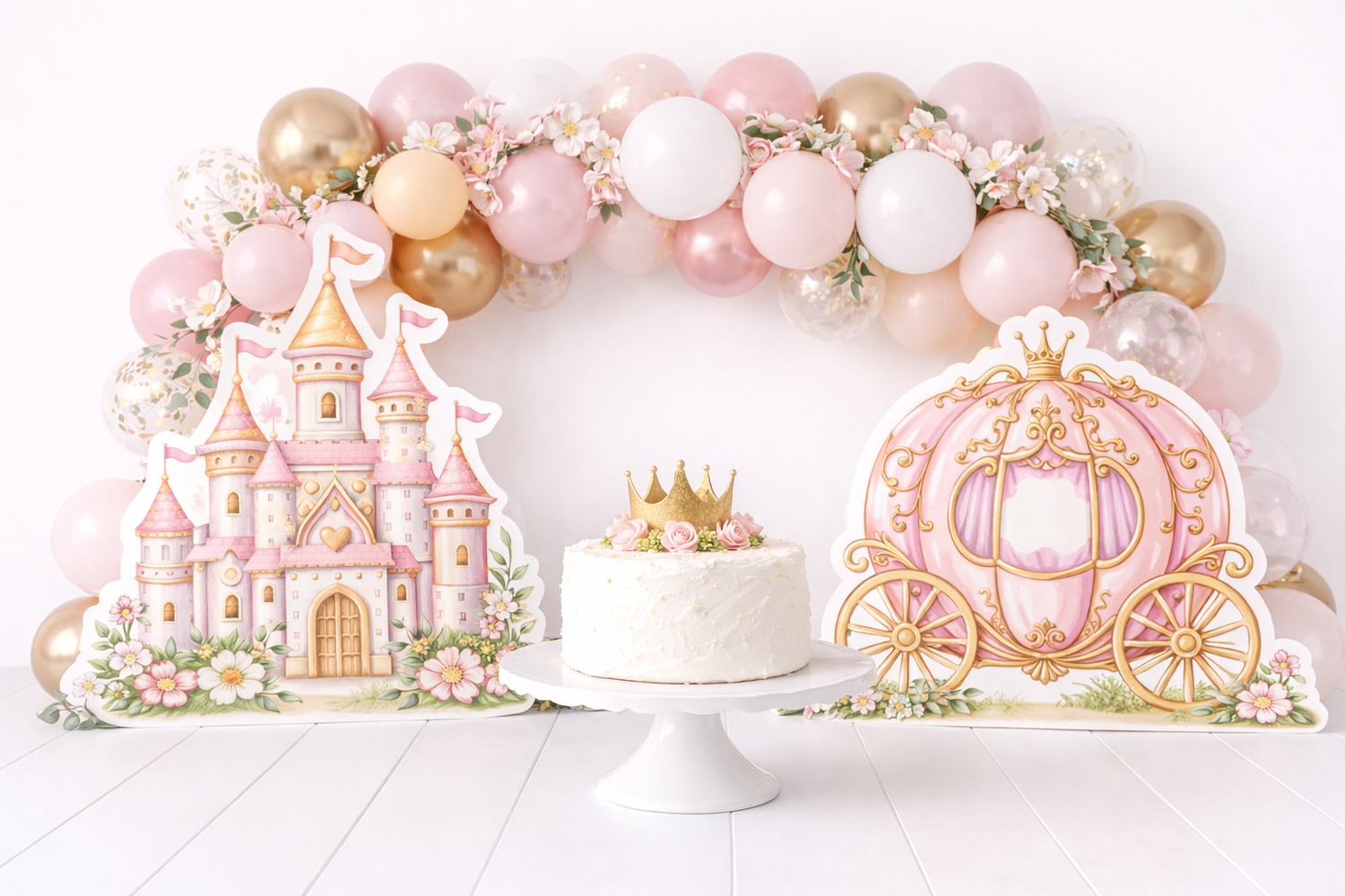 Pink princess birthday cake display with castle, carriage cutouts, and balloon arch in pink, white, and gold.Elizabeth Lang