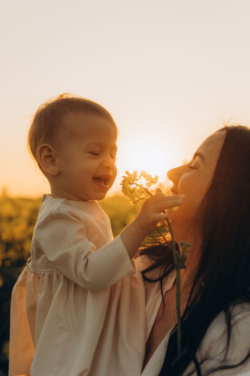 Outdoor family photography session in rapeseed field near Brussels