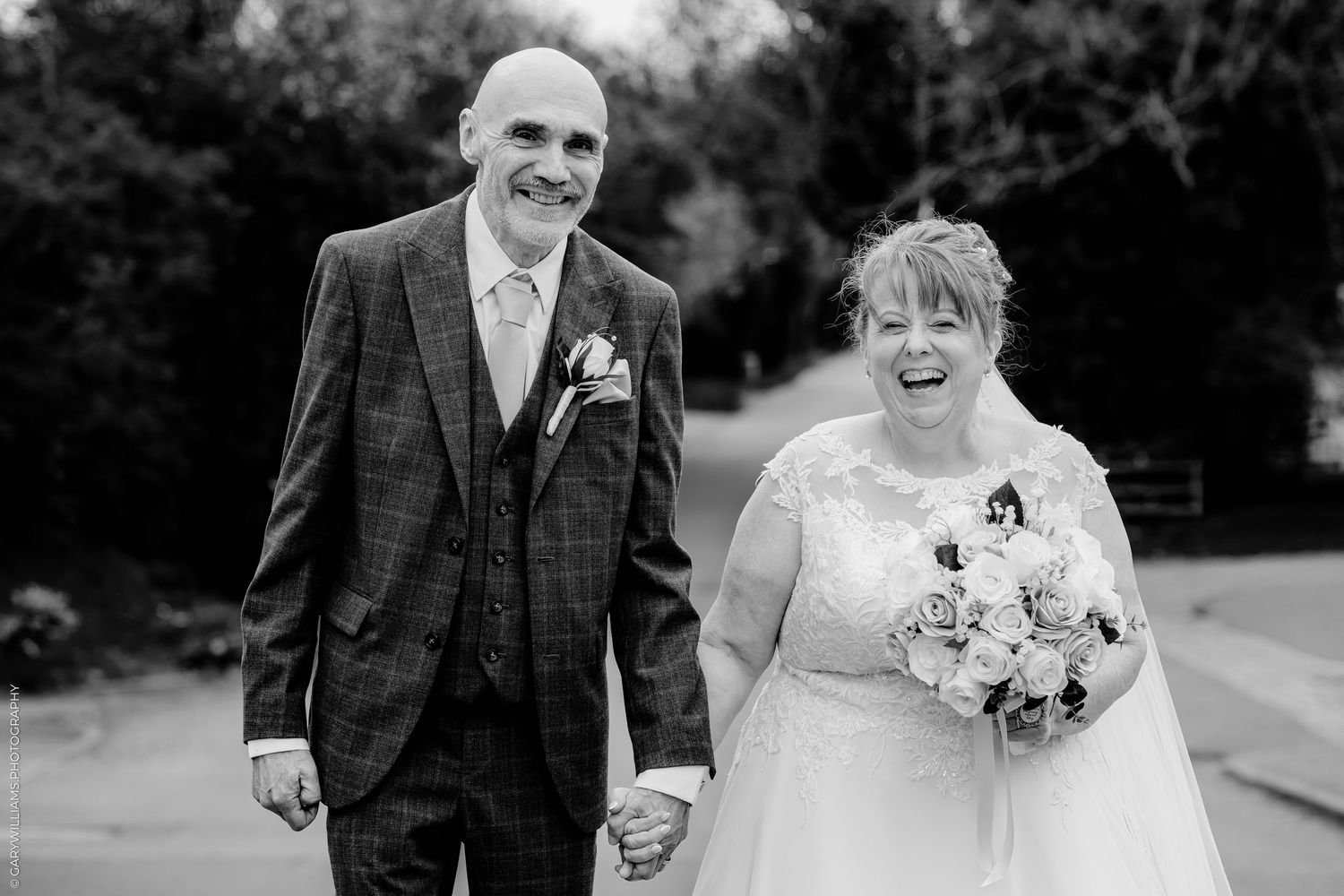 A series of black and white wedding photos showing a bride in a ballgown and guests at an elegant indoor reception.