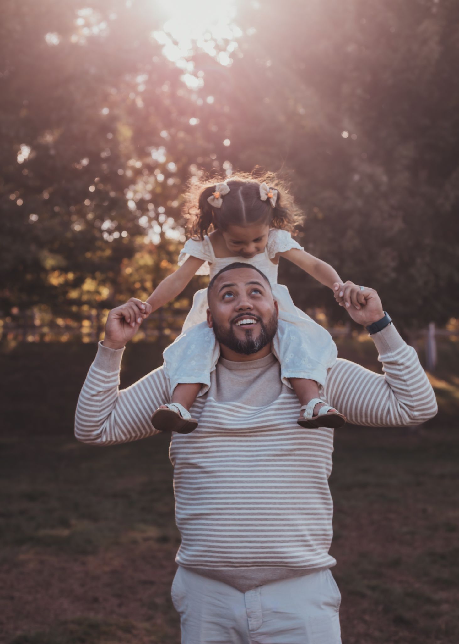 father with his daughter on shoulders sharing a special moment