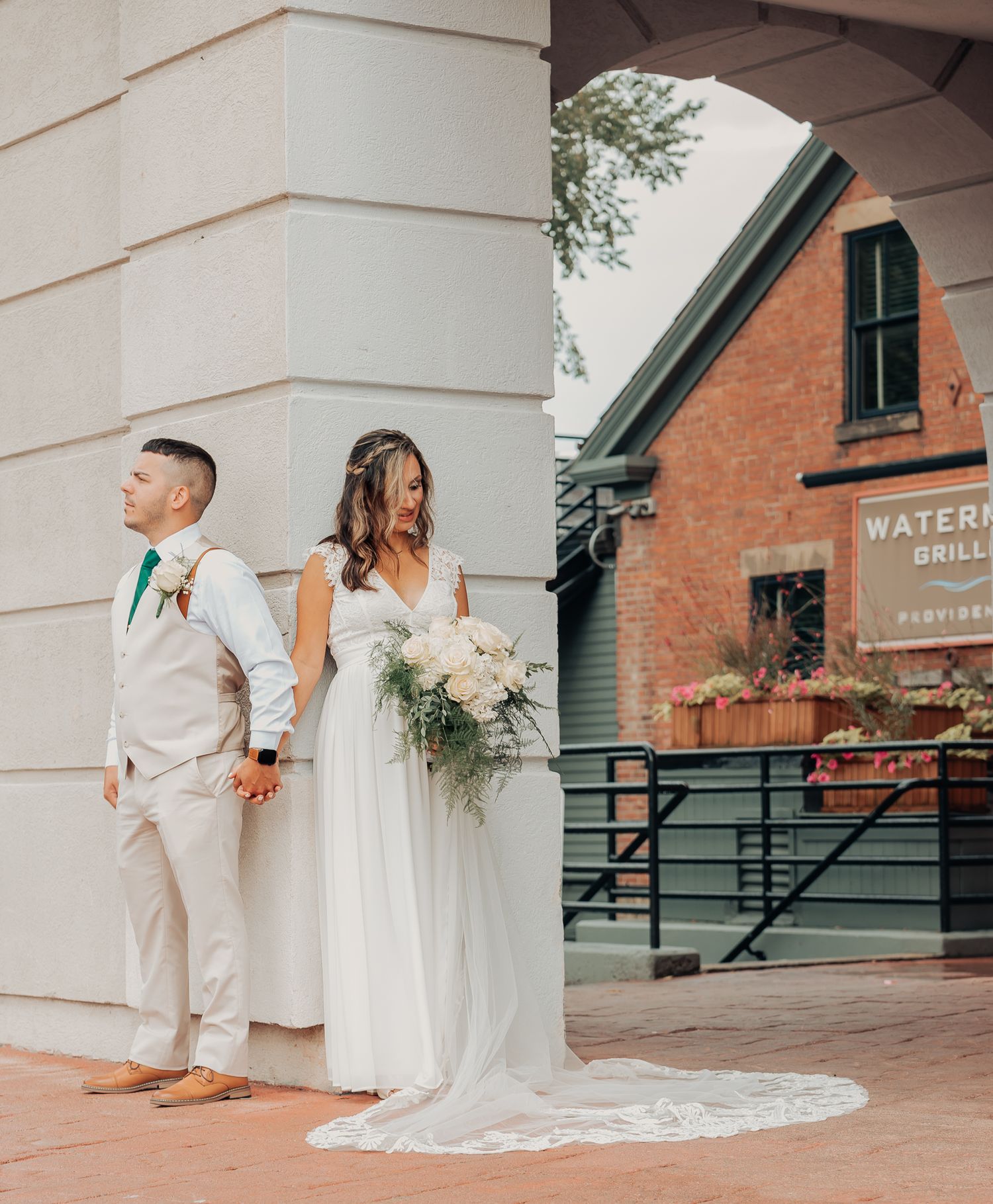 bride and groom's first look outside of waterman grill in rhode island
