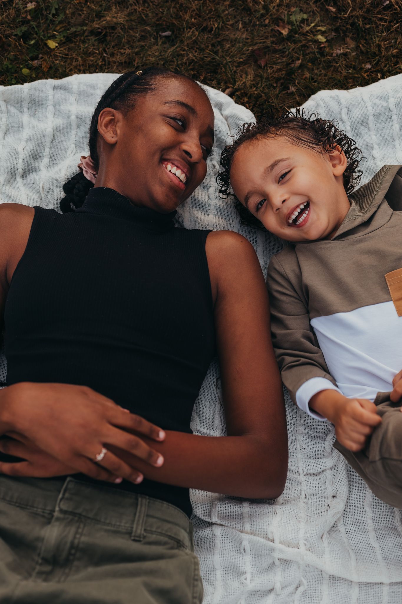 sister and brother laughing