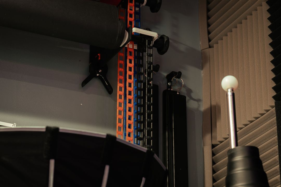 Mannyportraits Miami studio backdrop racks and gear wall, designed for elevated cinematic storytelling and professional photography."
