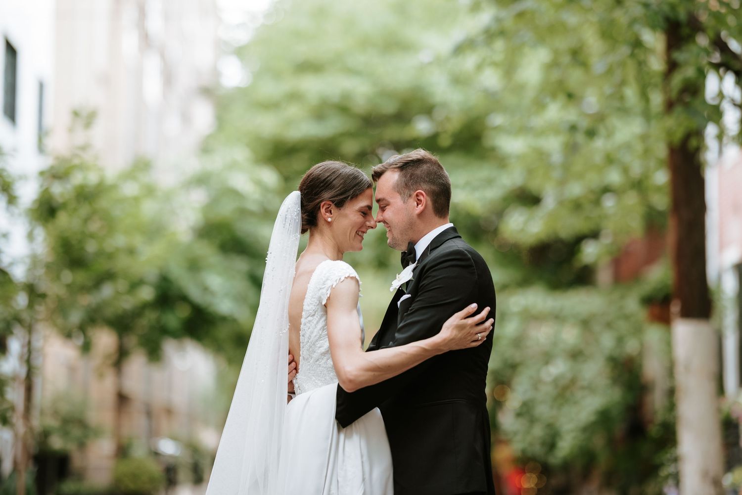 Bride and groom share a quiet, romantic moment near Ironworks at Pencoyd Landing—elegant Philly wedding portrait in nature’s glow.