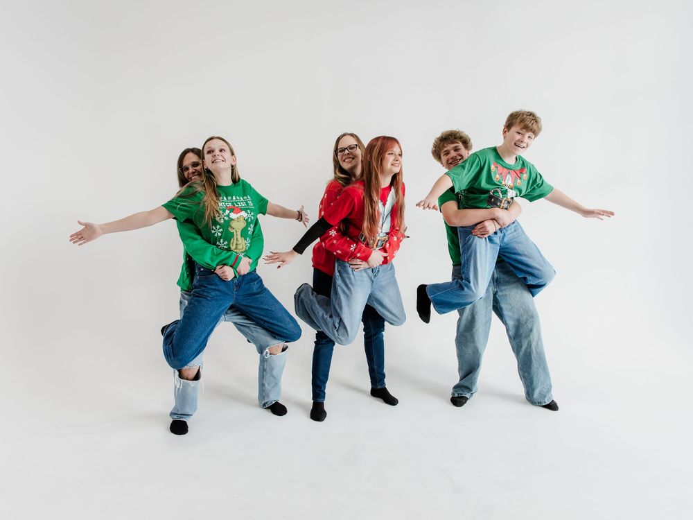Playful group photo sequence with coordinated dance-like movements against white backdrop.