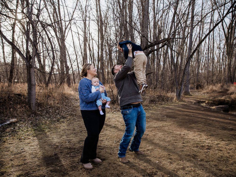 Family photoshoot sequence in a wooded area during autumn.