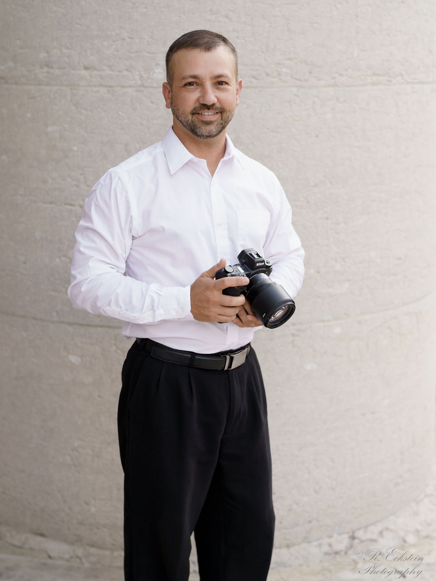 Portrait of guy holding camera