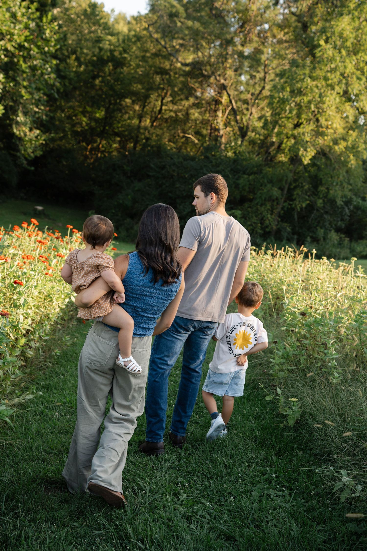 A family photo session where a mother and her children are running around playing candidly at Polen Farm in Kettering Ohio.