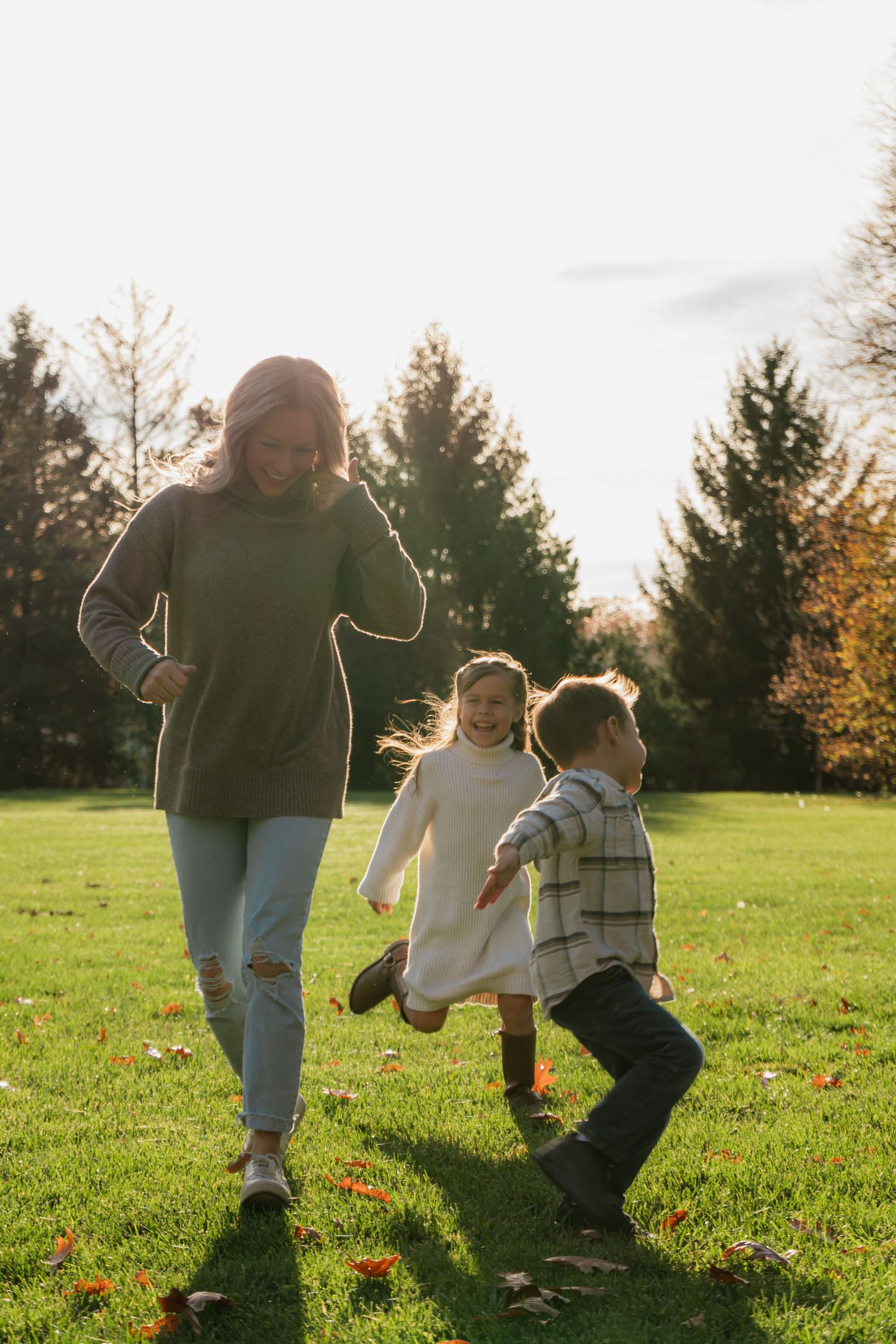 A family photo session where a mother and her children are running around playing candidly at Polen Farm in Kettering Ohio.