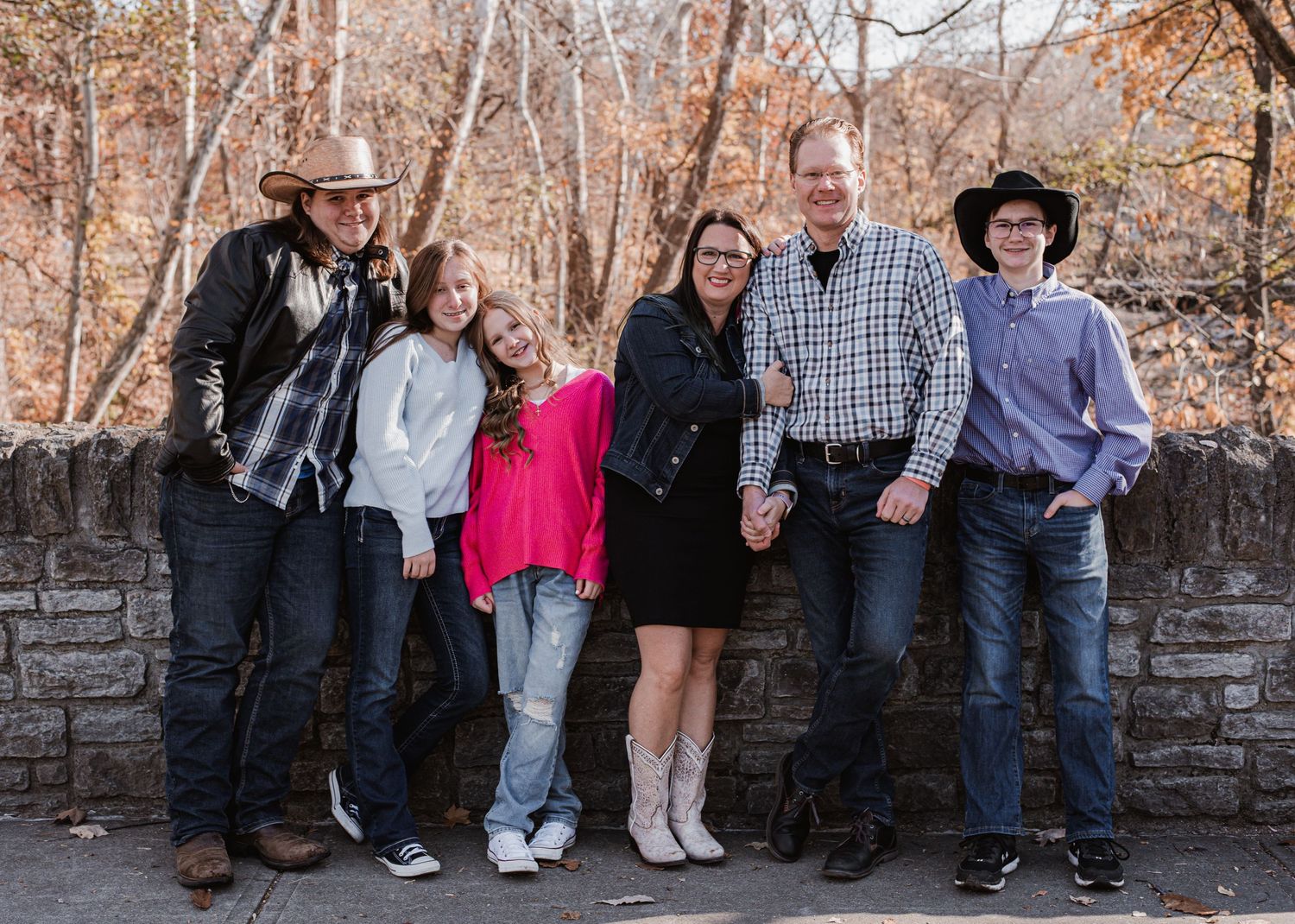 A family posing together at Sharon Woods.