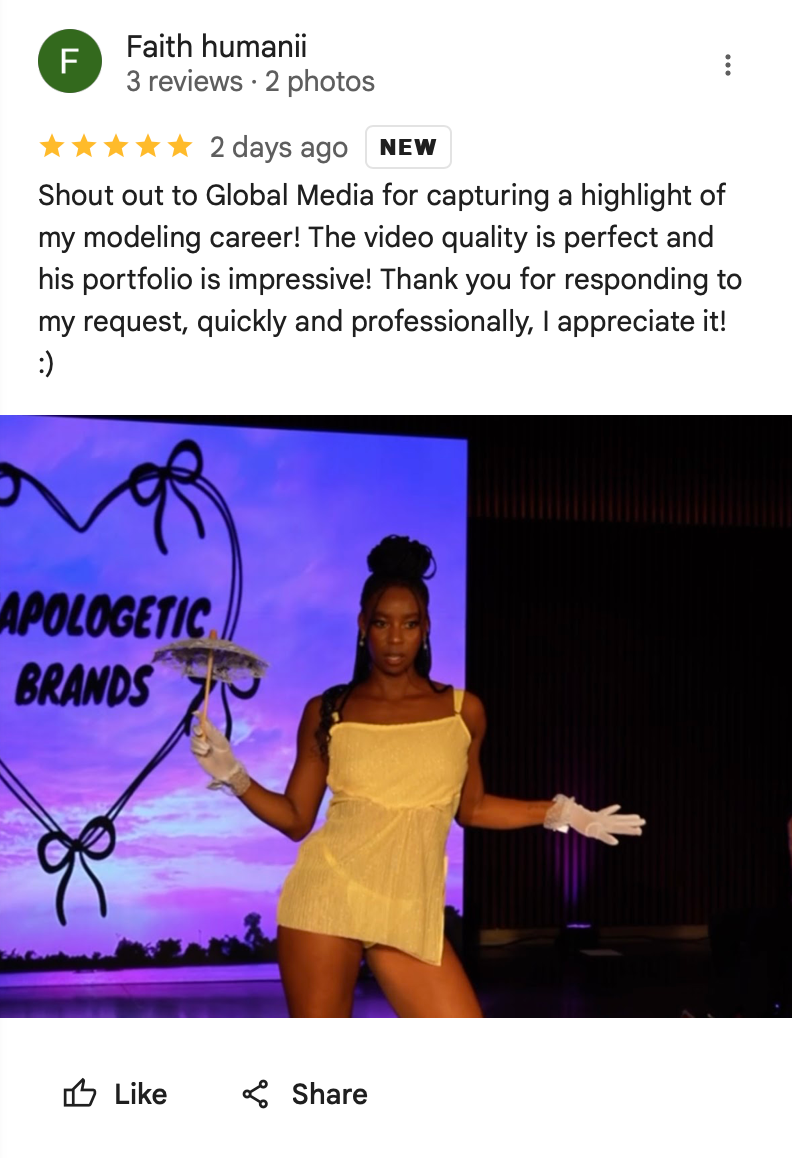 Performer in yellow dress posing on stage with purple neon Unapologetic Brands sign during fashion show.