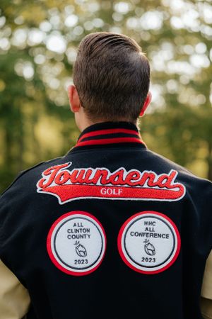 Townsend Golf varsity jacket showing 2023 All-Clinton County and NHC Conference patches.