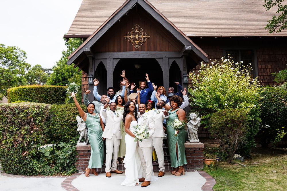 Wedding celebration at Chapel of Orange with all guests cheering for the newlyweds.