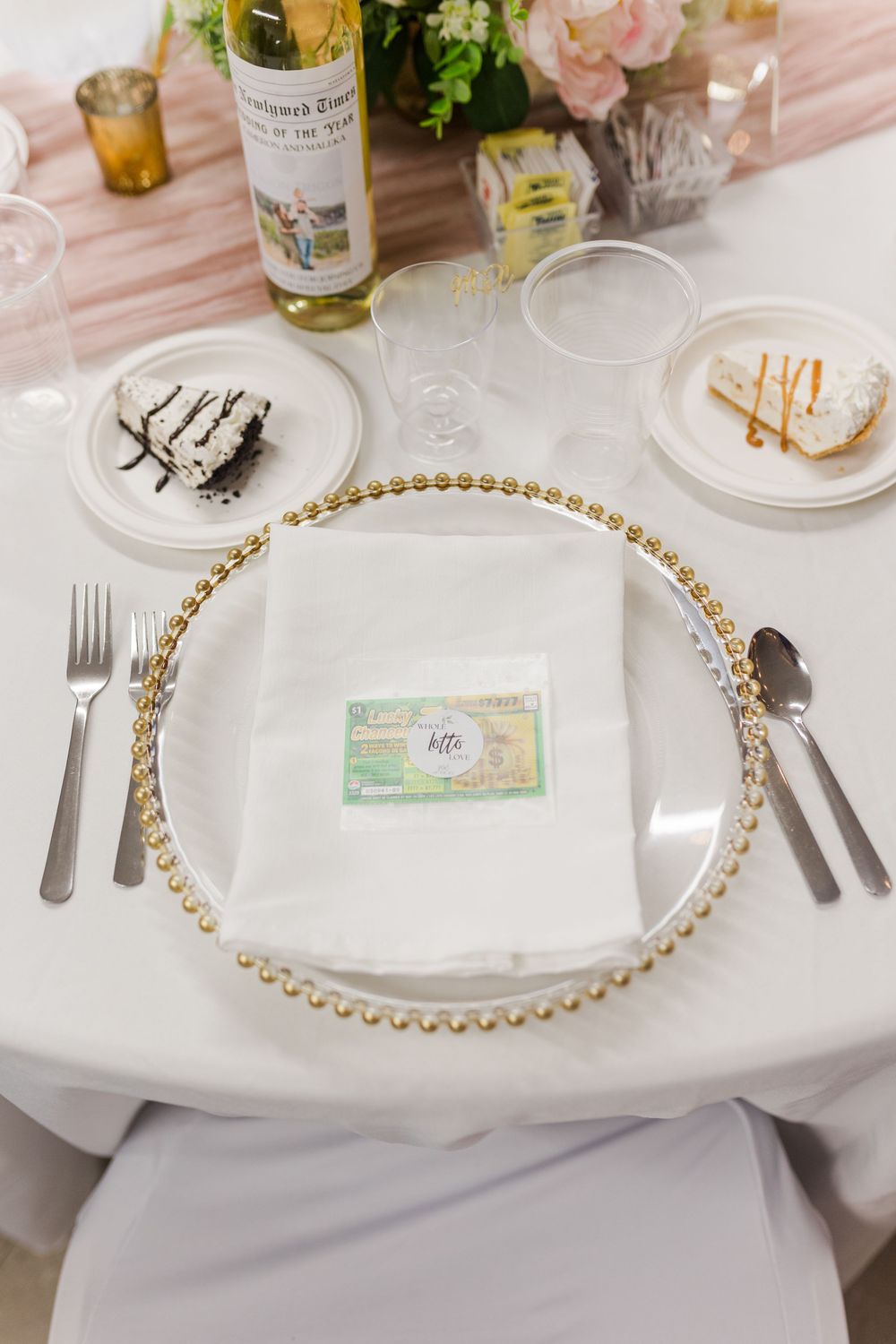 Elegant table settings with gold-rimmed plates and pearl beaded chargers on crisp white linens.