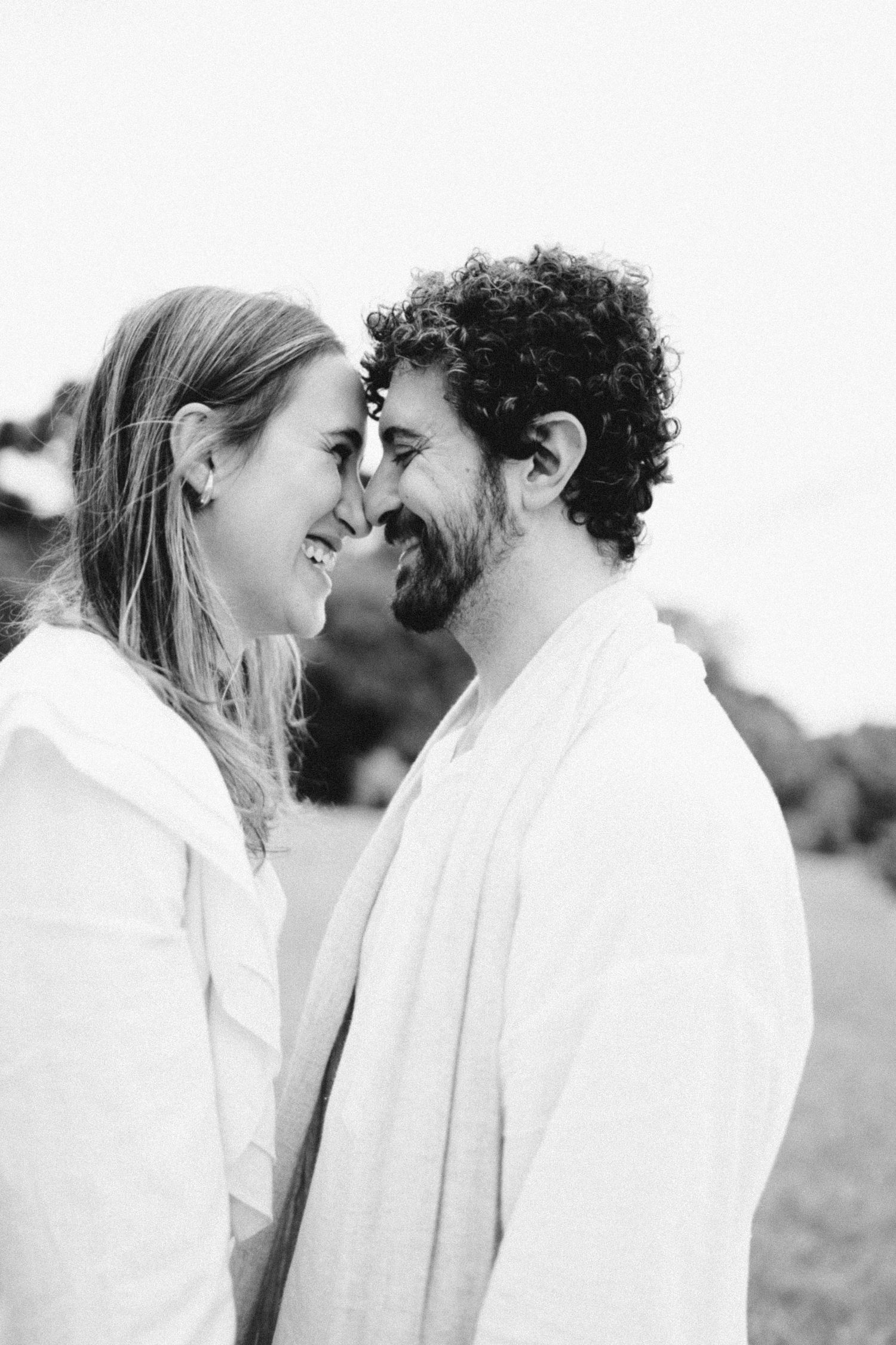 Romantic black and white portrait series showing tender moments between a couple.