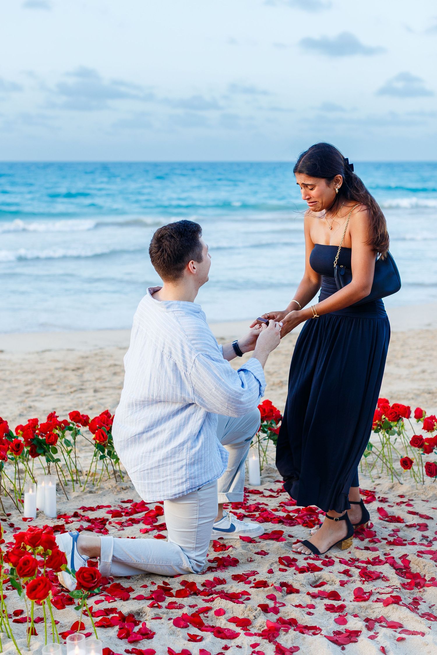 Couples portrait. Marriage proposal on the beach in Isla Verde, Carolina, Puerto Rico.