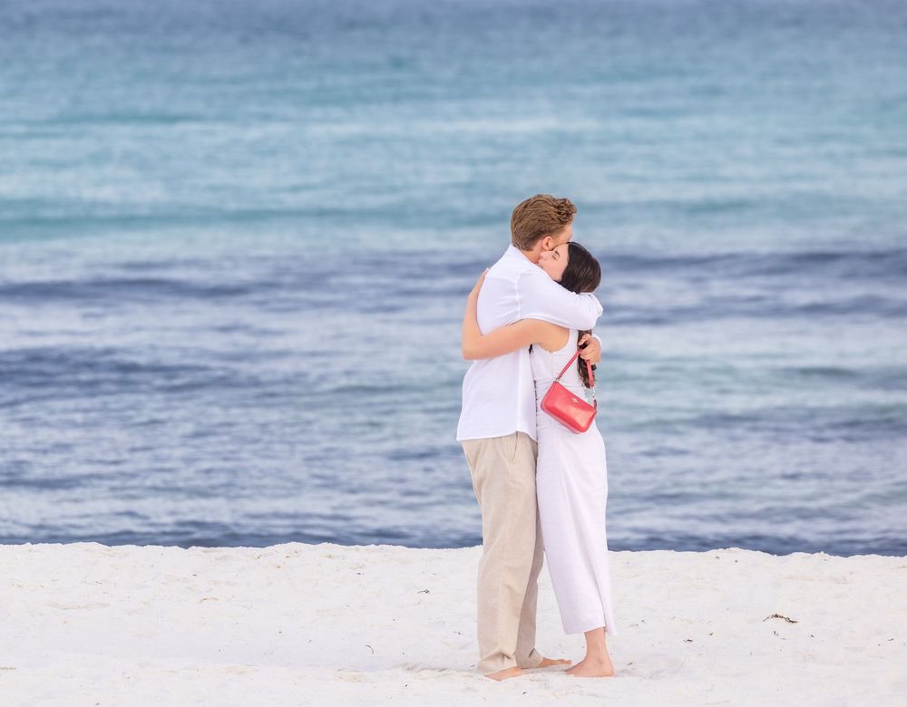 A sequence of photographs shows silhouettes of two people embracing on a beach with ocean waves in the background.