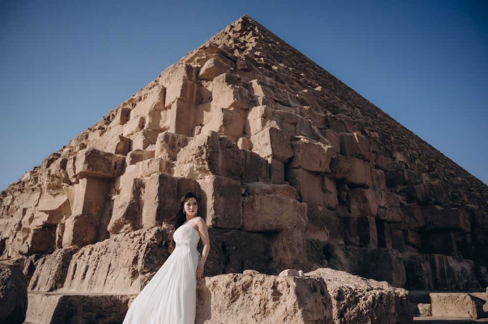 Beautiful desert wedding photography session featuring scenic rocky canyon and pyramid shapes in warm golden light.