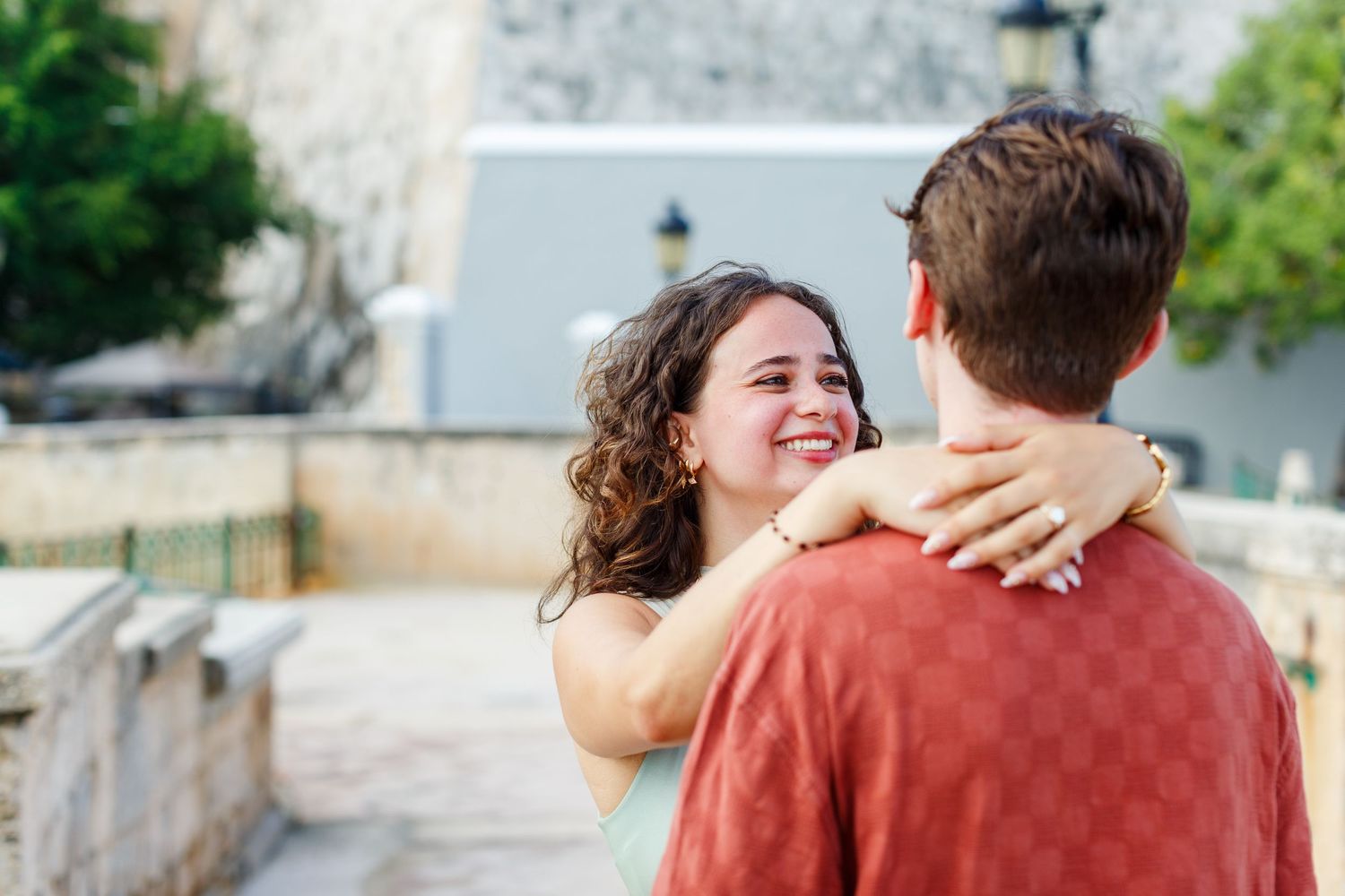 Surprise marriage proposal in Old San Juan, Puerto Rico. Paseo de la Princesa. Man and woman.