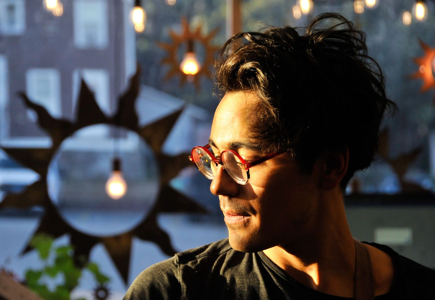 Man poses in golden hour light during portrait photography session.